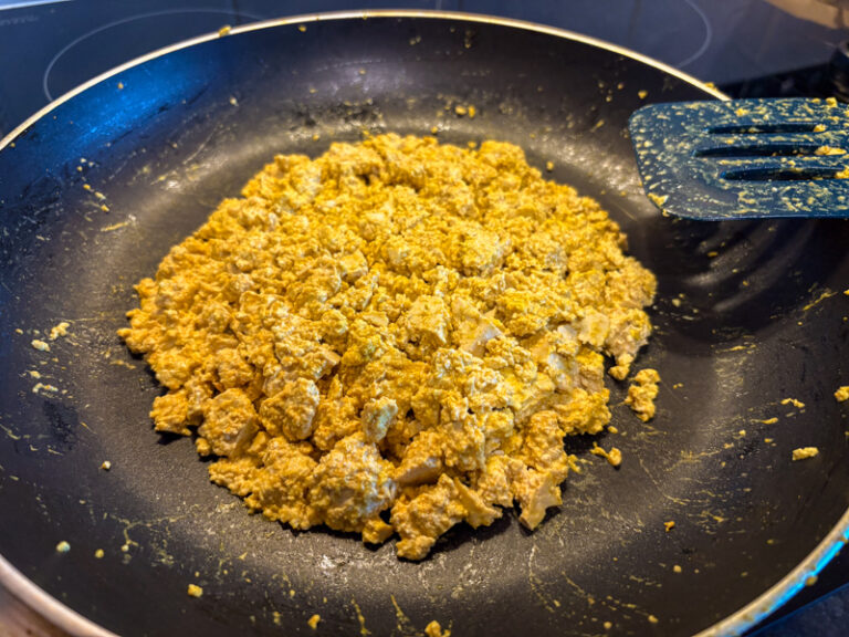 Image of scrambled tofu being cooked in a pan.